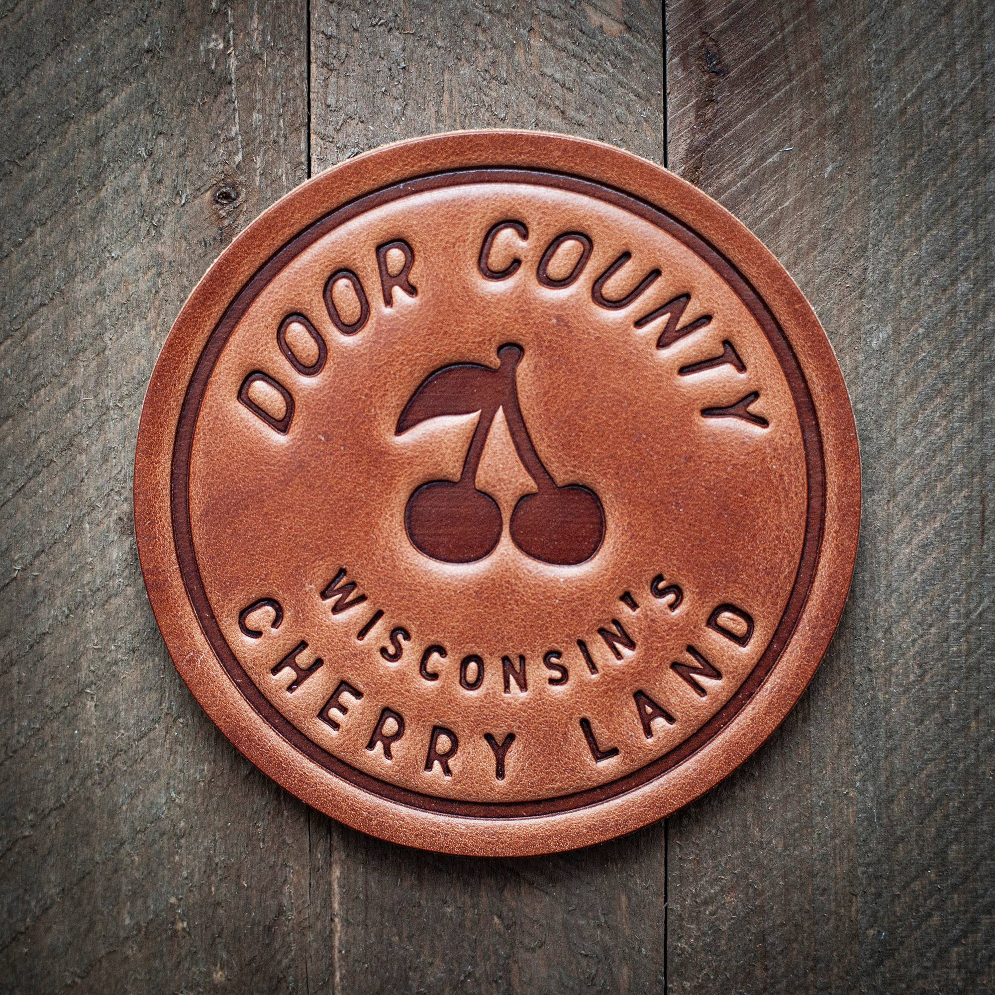 Door County Wisconsin's Cherry Land Leather Coaster